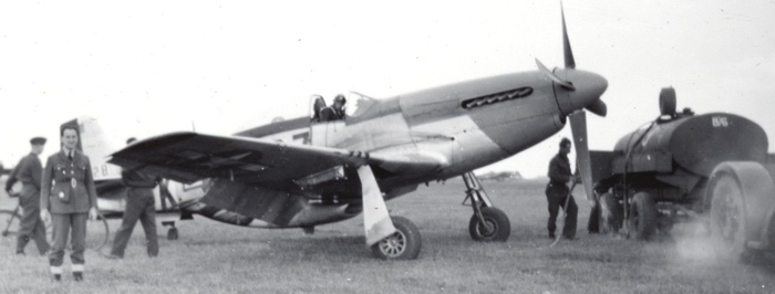 spitfire being refueled - marcel baillargeon near the wingtip t.jpg